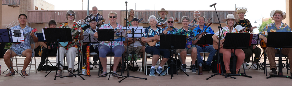 The Las Cruces Ukes on stage at a performance.